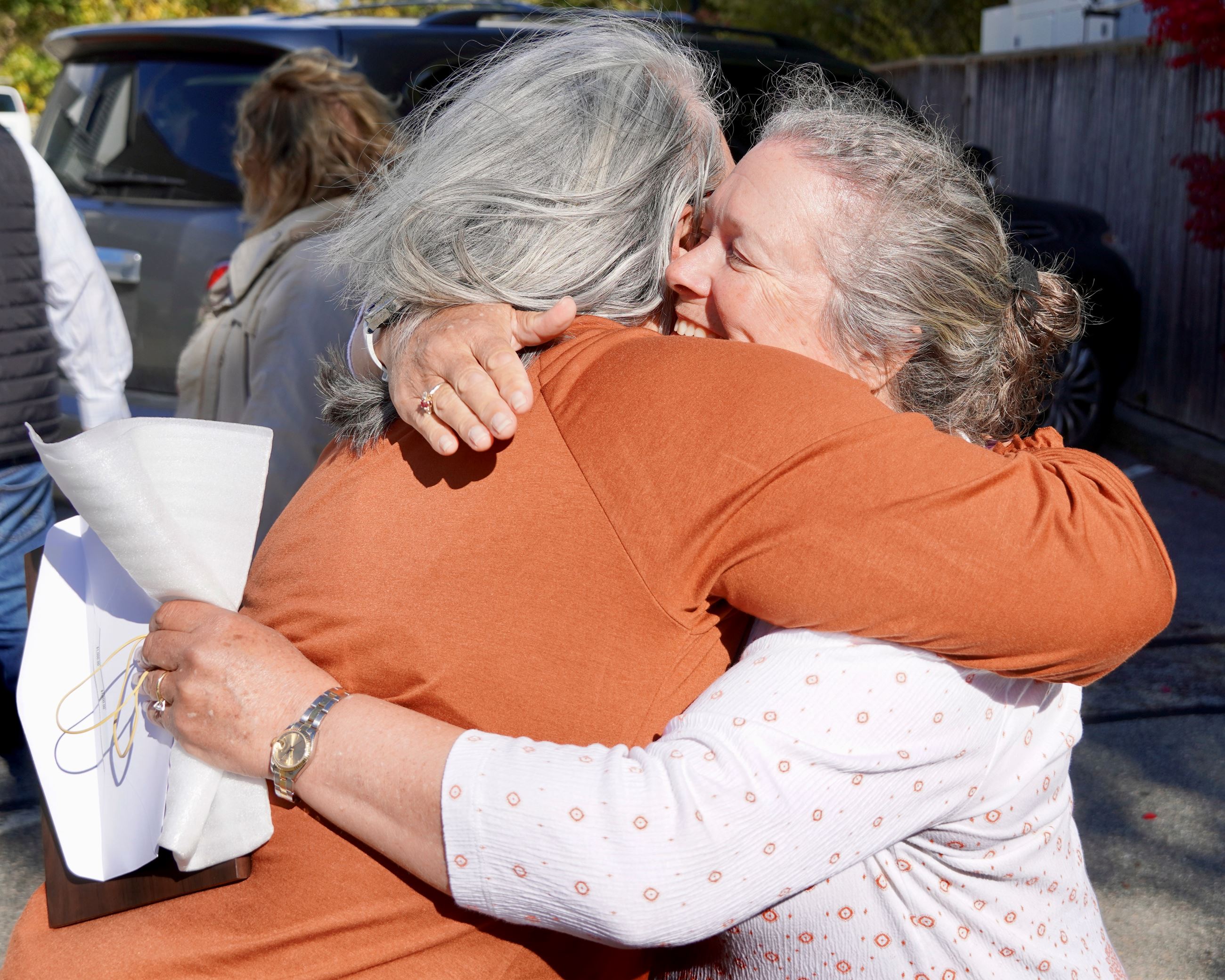 Wellness Committee RI Interlocal Risk Management Trust 1000 Check And Silver Level Award Hug Shot